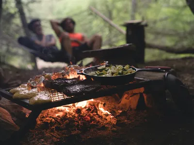 Camp kitchen setup with the Missouri in the background